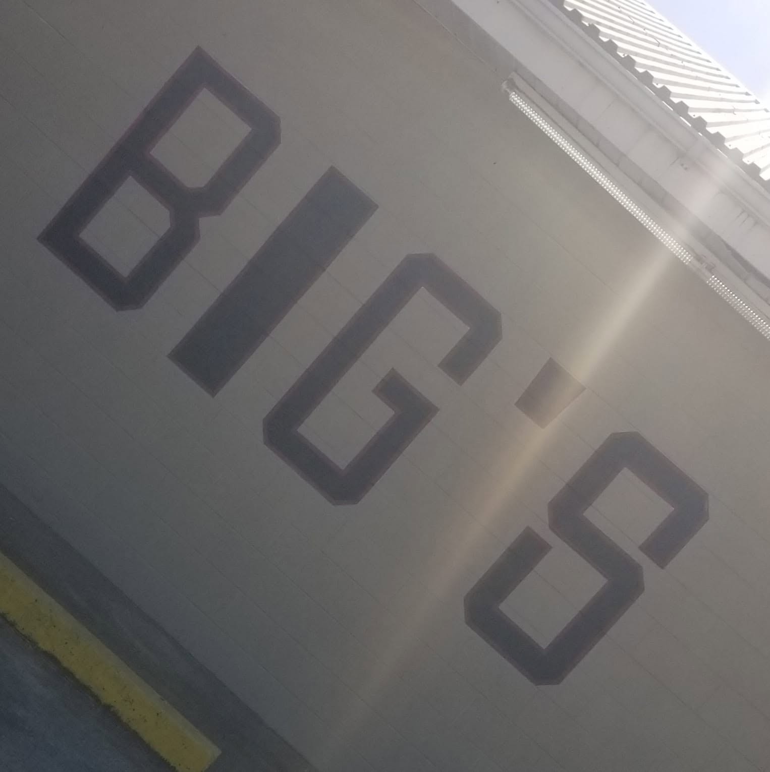 Tall black BIG'S letters mounted on the store's exterior wall