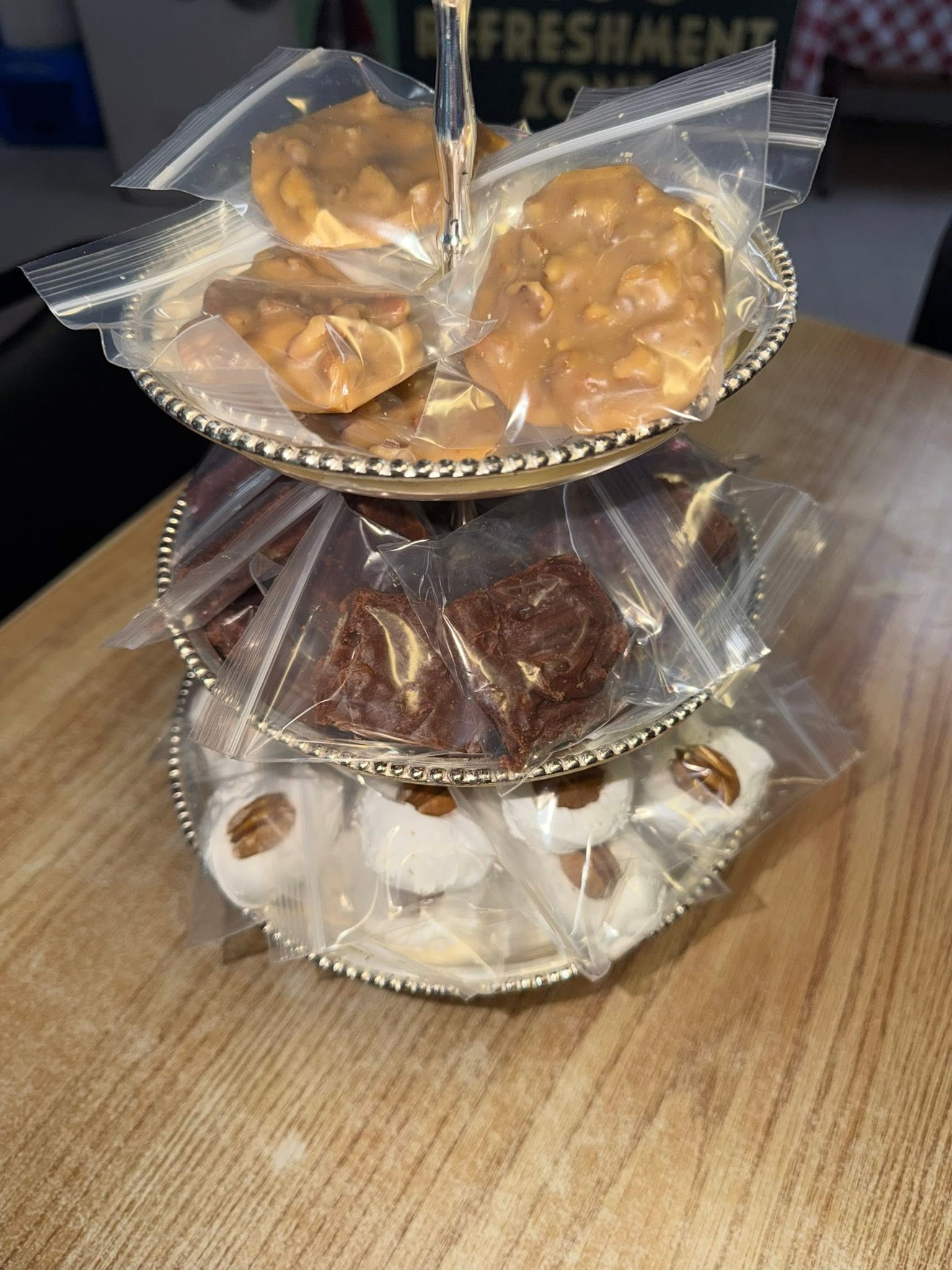 Three-tiered stand of wrapped homemade treats